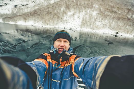 Seifie on beautiful mountain landscape with the Norwegian fjords in winter