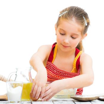 cute llittle girl cooking isolated on a white background