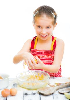 cutre little girl making dough, on a white background