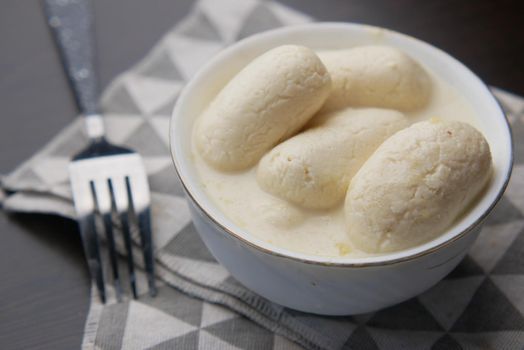 close up of indian sweet in a bowl on table