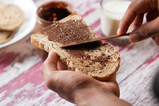 Chocolate Hazelnut Spread on a Bread on Table