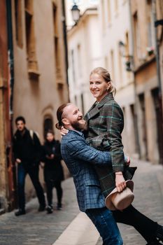 Beautiful family with walks in the old city of Lyon in France.A couple walks through old Lyon in France.