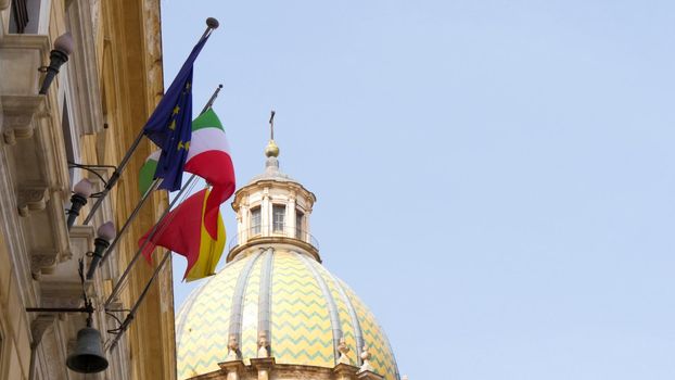 Flags of Italy and the European Union on roof at Rome, Italy, telephoto