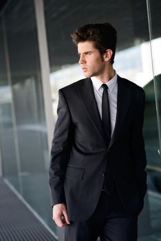 Portrait of an attractive young businessman in urban background