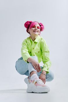 glamorous fashionable woman with pink hair posing hipster neon. High quality photo