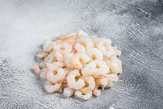 Peeled raw Shrimps, Prawns on a table. White background. top view.