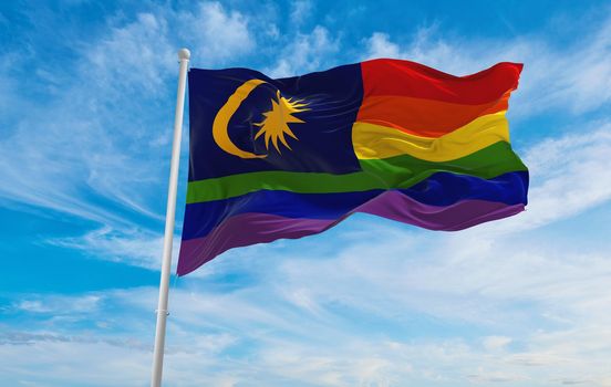flag of LGBT Pride, Malaysia waving in the wind at cloudy sky. Freedom and love concept. Pride month. activism, community and freedom Concept. Copy space. 3d illustration