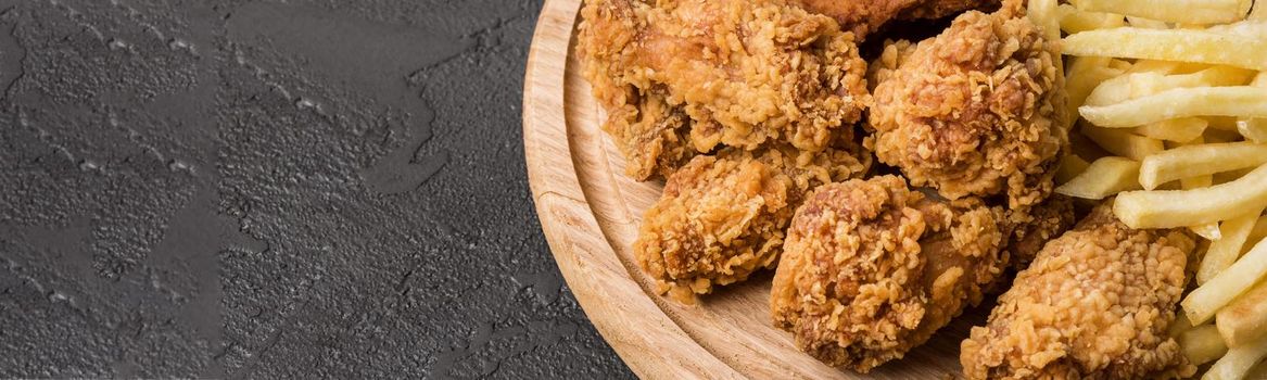 high angle fried chicken wings with fries