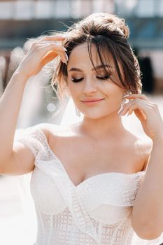 Portrait of the bride in close-up.A stunning young bride with curly hair . Wedding day. . Beautiful portrait of the bride without the groom