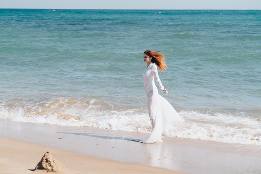 pretty woman walks along the coast landscape ocean Lifestyle. High quality photo