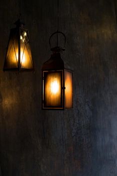 Lantern hang in front of wooden house in the night