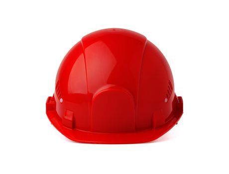 Red plastic safety hardhat isolated on white background, close up