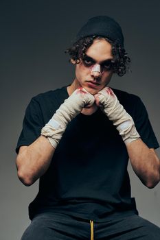 boxer training broken face the dark background fighter. High quality photo