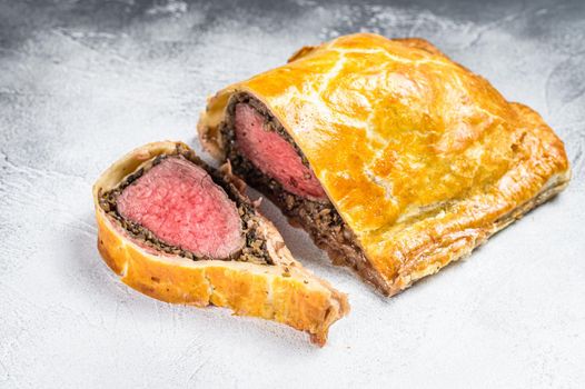 Beef Wellington puff pie classic steak dish with tenderloin meat. White background. Top view.