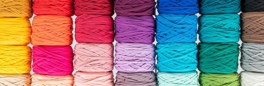 Rows of multicolored cotton yarn. The assortment of the store for needlework