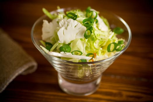 light spring salad with cauliflower, green onions and white cabbage