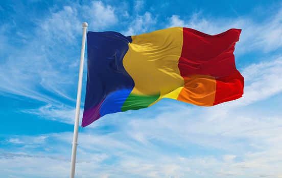 national lgbt flag of Romania flag waving in the wind at cloudy sky. Freedom and love concept. Pride month. activism, community and freedom Concept. Copy space. 3d illustration