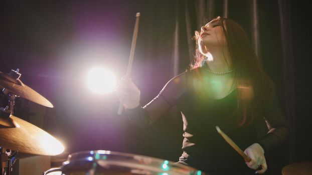 Gothic girl percussion drummer perform music break down - teen rock music, telephoto