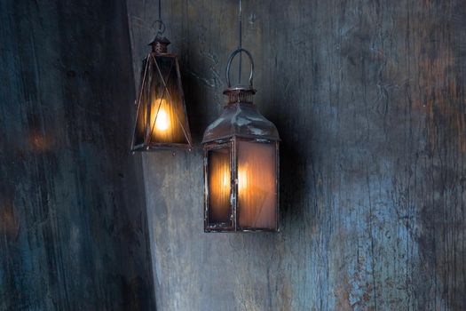 Lantern hang in front of wooden house in the night