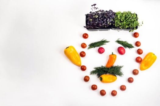 The face of a man made of sliced vegetables on a white background.