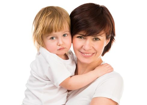 young dark-haired woman holding a little blond baby on hands on a white background