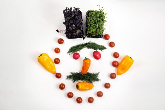 The face of a man made of sliced vegetables on a white background.