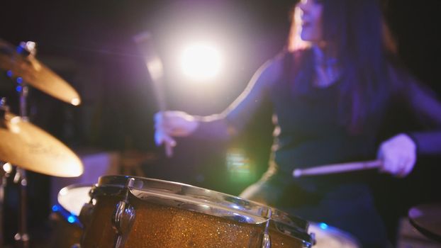 Concert rock band performing - drummer, de-focused, telephoto