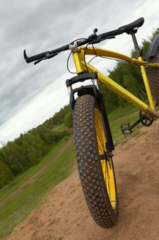 Steering of Fat bike at summer countryside - dirty bicycle, horizontal, horizontal photo