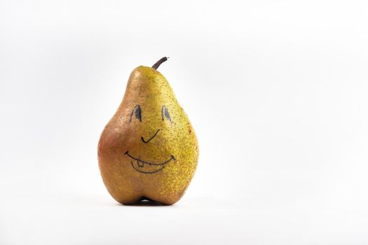 A large pear with a painted smiley face on a white isolated background.