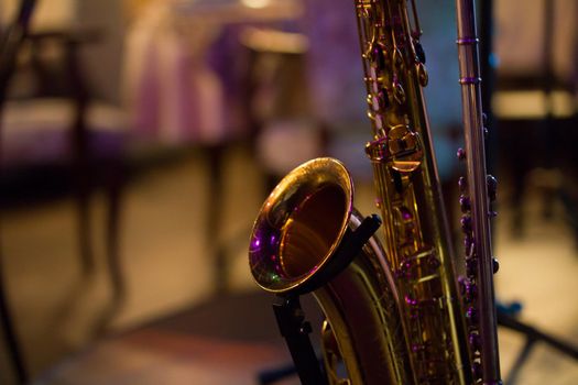 Saxophone on stage in jazz cafe, close up