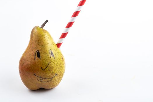 A large pear with a drinking tube sticking out of it on a white background.