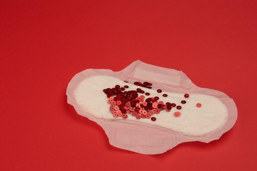 feminine pad blood menstruation hygiene red background. High quality photo