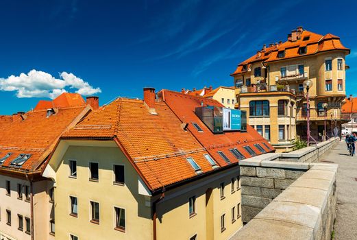 Maribor - June 2020, Slovenia: View from the Old Bridge (Glavni Most) on the old historical building with red roof tiles 