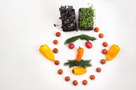 The face of a man made of sliced vegetables on a white background.