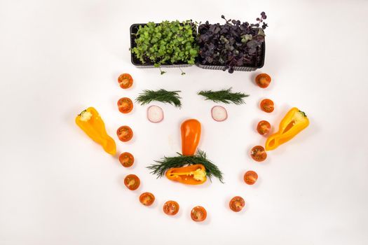 A person's face made of vegetables on a white background.