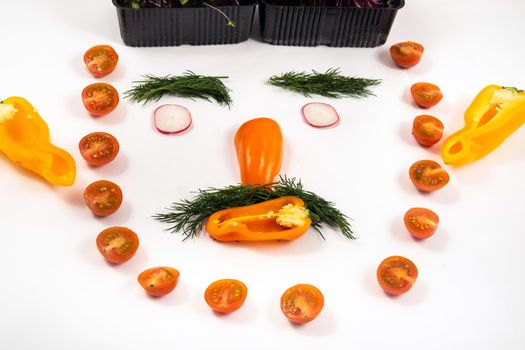 A person's face made of vegetables on a white background.