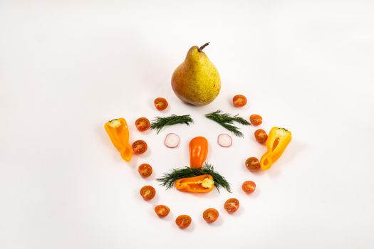 The face of a man made of sliced vegetables and a pear on his head on a white background.