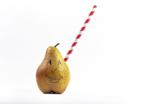 A large pear with a drinking tube sticking out of it on a white background.