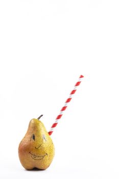 A large pear with a drinking tube sticking out of it on a white background.