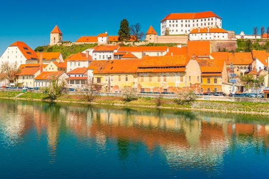 Ptuj - March 2021, Slovenia: View of the ancient Slovenian town of Ptuj reflected in the water
