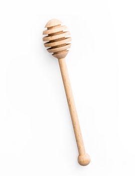 wooden spoon for honey isolated on a white background