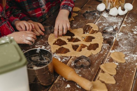 high angle children making cookies together home