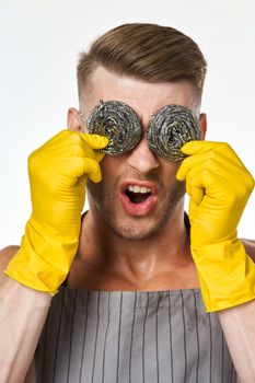 pumped up man in rubber gloves metal sponges close-up. High quality photo