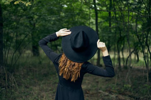 cheerful woman witch in the forest posing fantasy. High quality photo