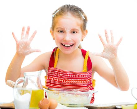 cute little girl baking on kitchen and shows hands isolated on a white background