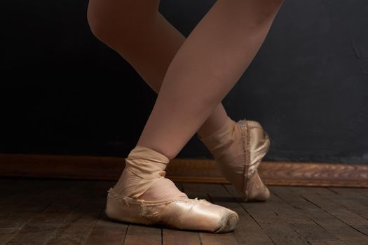 ballerina legs exercise performance classical style close-up. High quality photo