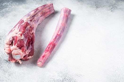 Raw whole Beef veal Oxtail Meat on butcher table. White background. Top view. Copy space.