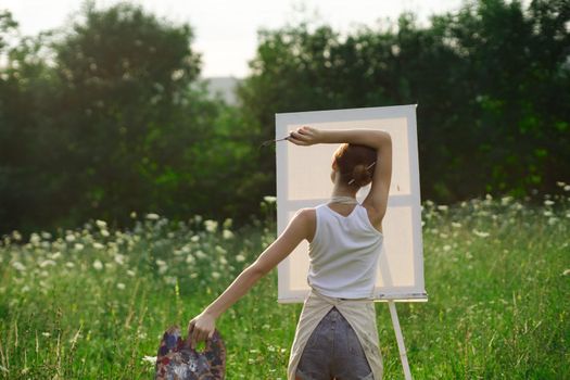 woman artist nature drawing art creative picnic. High quality photo