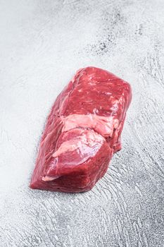 Raw veal meat steak fillet. White background. Top view. Copy space.