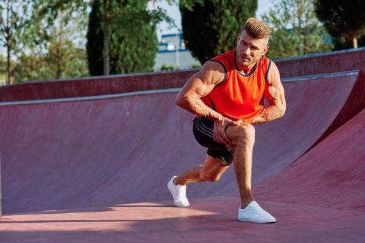 man doing exercises outdoors in the park. High quality photo